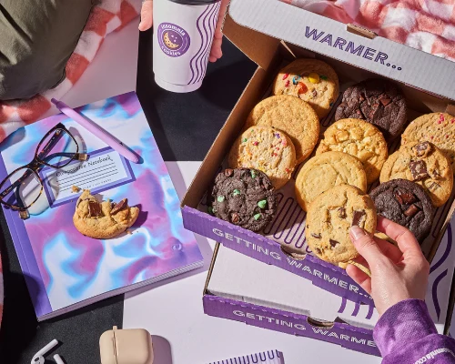 A box of Insomnia Cookies with a cup of coffee